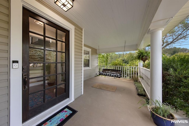 view of patio featuring a porch