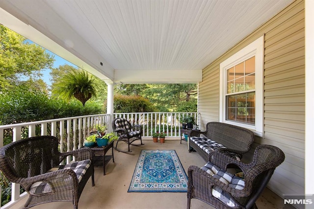 exterior space featuring a porch and an outdoor hangout area