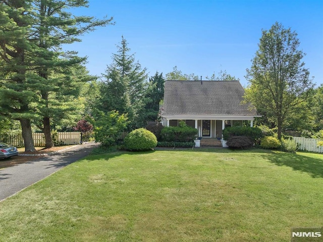 cape cod-style house with a front lawn