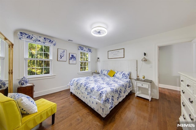 bedroom featuring dark hardwood / wood-style flooring