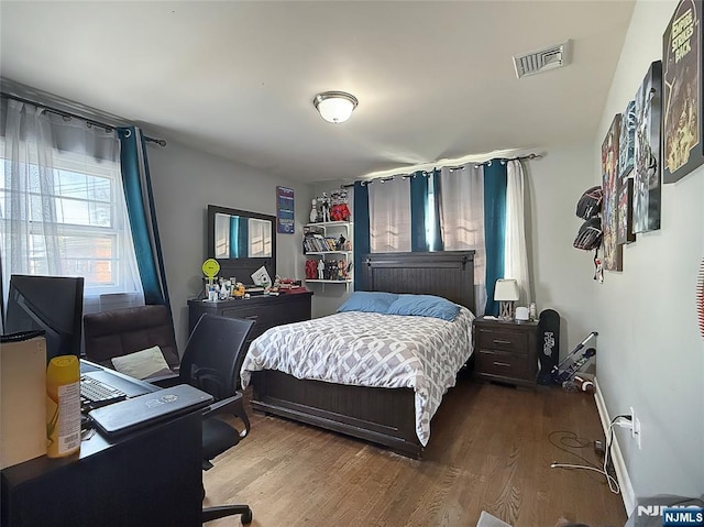 bedroom with hardwood / wood-style floors