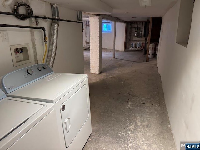 clothes washing area with separate washer and dryer