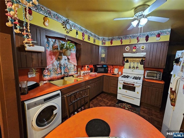 kitchen with dark parquet floors, washer / dryer, sink, dark brown cabinets, and white appliances