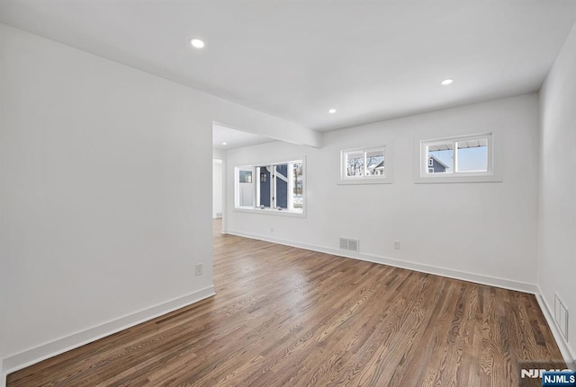 unfurnished room featuring hardwood / wood-style floors