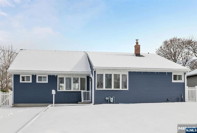 view of snow covered house