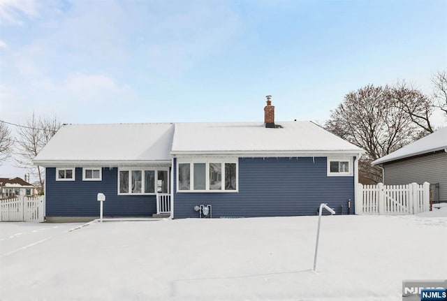 view of snow covered house