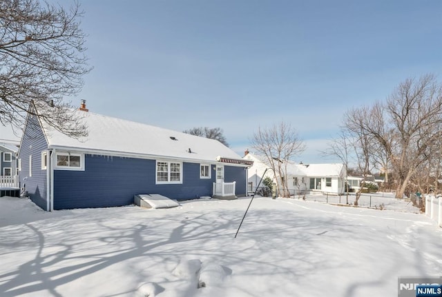 view of snow covered house