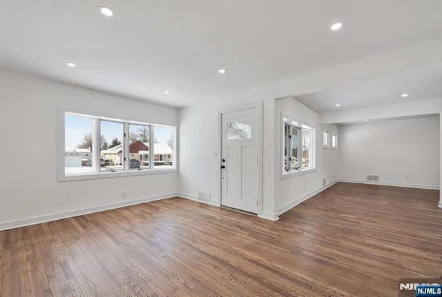 foyer featuring dark wood-type flooring