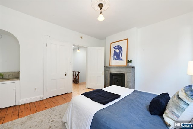 bedroom with light wood-type flooring