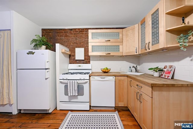 kitchen featuring butcher block countertops, white appliances, sink, dark hardwood / wood-style floors, and light brown cabinets