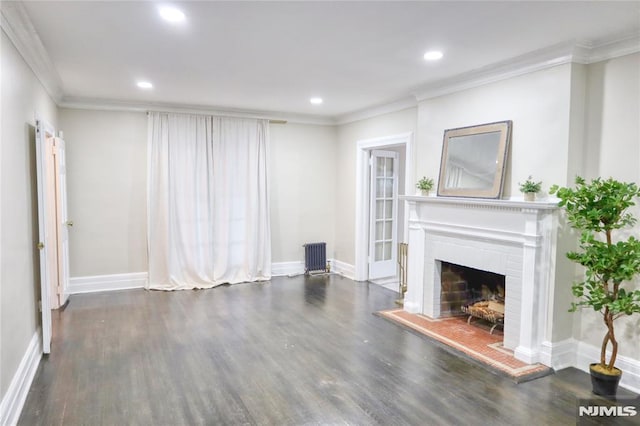 unfurnished living room featuring ornamental molding, dark wood-type flooring, and radiator