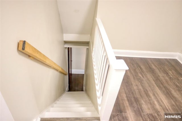 stairs with wood-type flooring