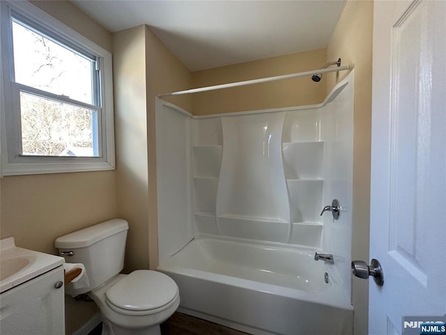 full bathroom featuring vanity, shower / tub combination, and toilet