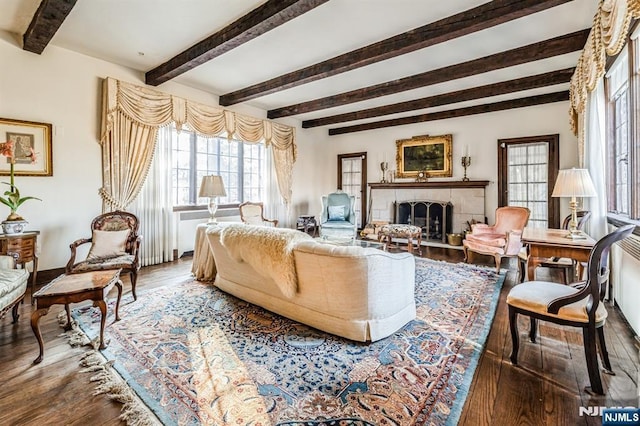 living room featuring hardwood / wood-style flooring and beamed ceiling