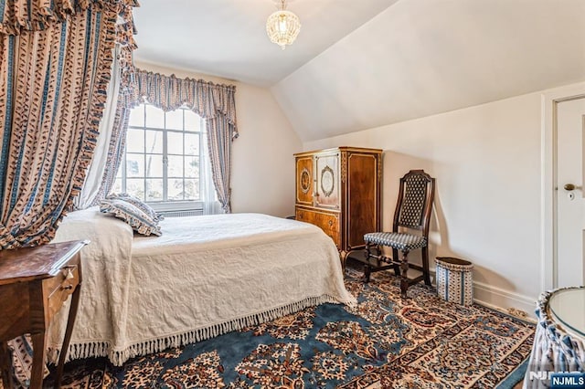 bedroom with vaulted ceiling