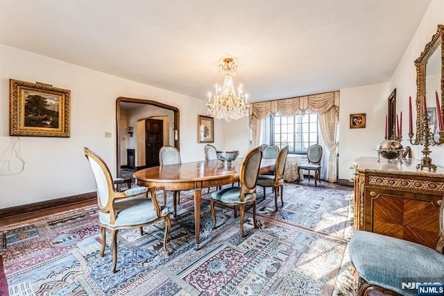 dining area featuring a chandelier