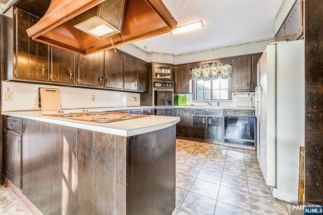 kitchen featuring dishwasher, white fridge, exhaust hood, kitchen peninsula, and dark brown cabinets