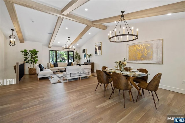 dining area with a chandelier, wood finished floors, recessed lighting, and baseboards
