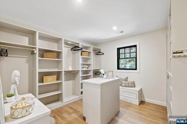 spacious closet with light wood-style flooring
