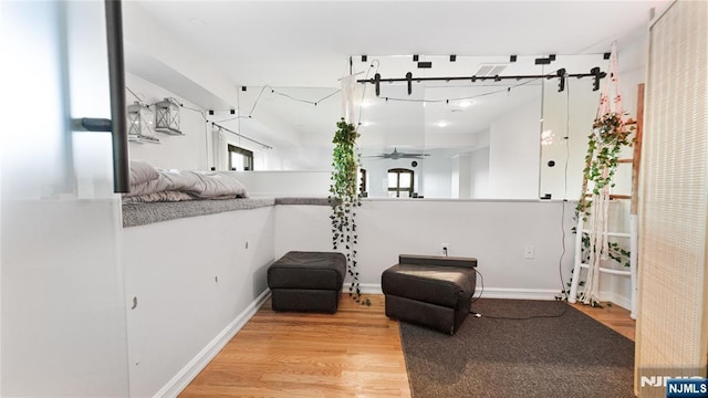 sitting room featuring light hardwood / wood-style floors