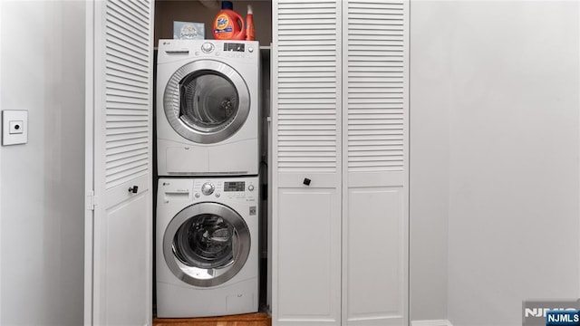 laundry room featuring stacked washing maching and dryer