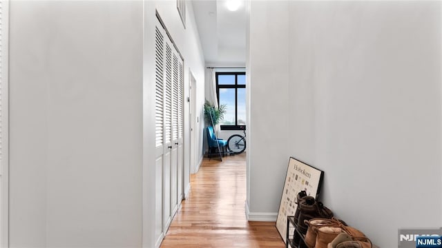 hallway with light wood-type flooring