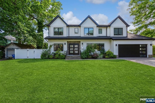 view of front of house featuring a front lawn and french doors