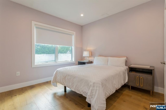 bedroom with light wood-type flooring