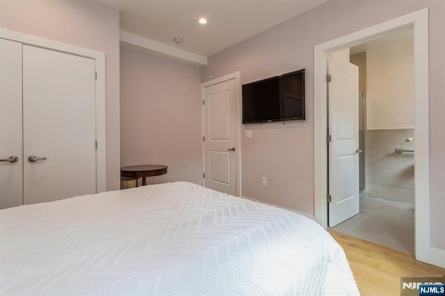 bedroom with a closet and light wood-type flooring