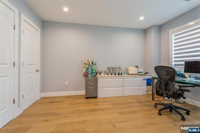 office with light hardwood / wood-style floors