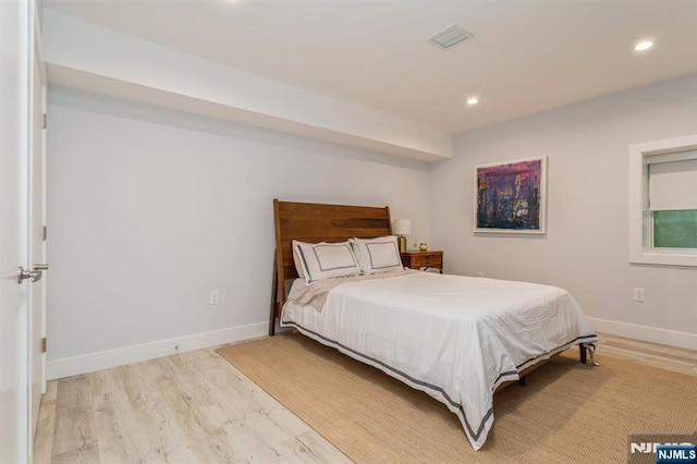 bedroom with light hardwood / wood-style floors