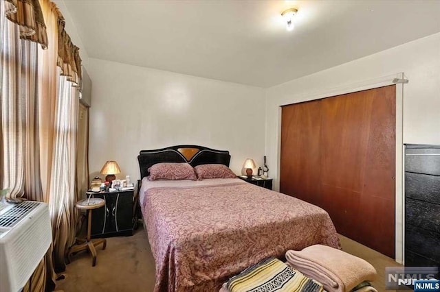 carpeted bedroom featuring a closet