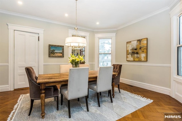 dining space with crown molding and dark parquet floors