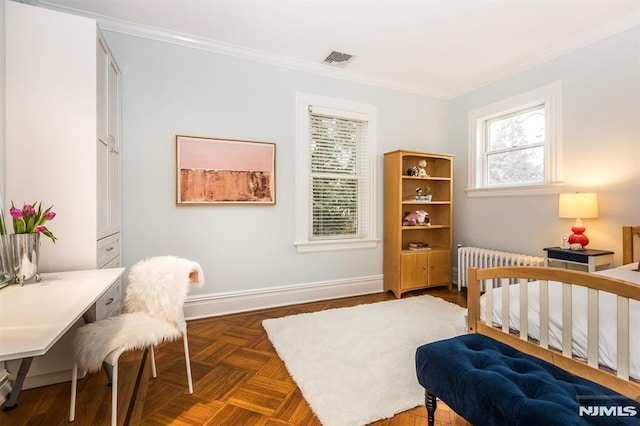 bedroom featuring ornamental molding, radiator heating unit, and dark parquet floors