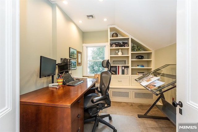 office featuring lofted ceiling and carpet