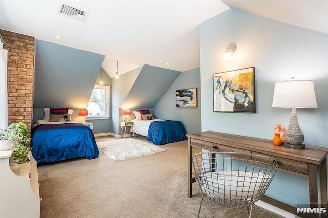 bedroom with vaulted ceiling and carpet flooring