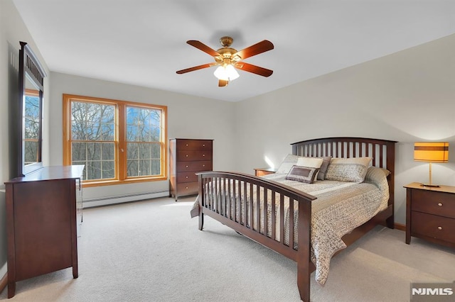 bedroom featuring baseboard heating, carpet flooring, baseboards, and a ceiling fan