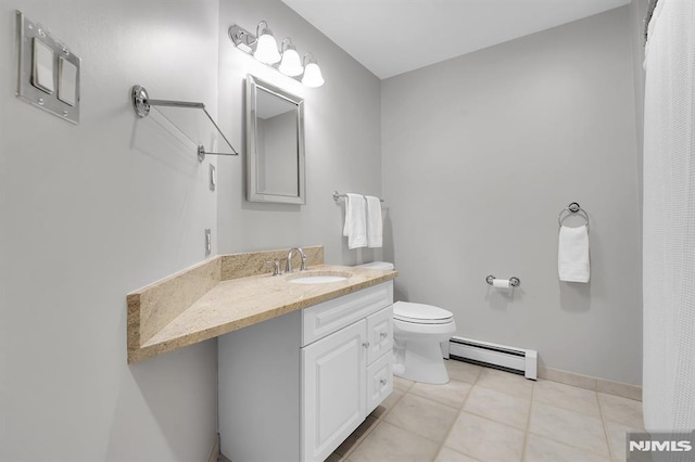 bathroom with tile patterned flooring, baseboards, toilet, vanity, and a baseboard radiator