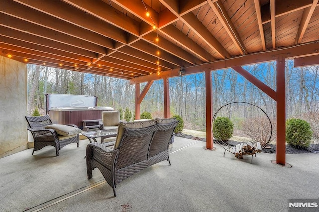 view of patio featuring an outdoor hangout area and a hot tub