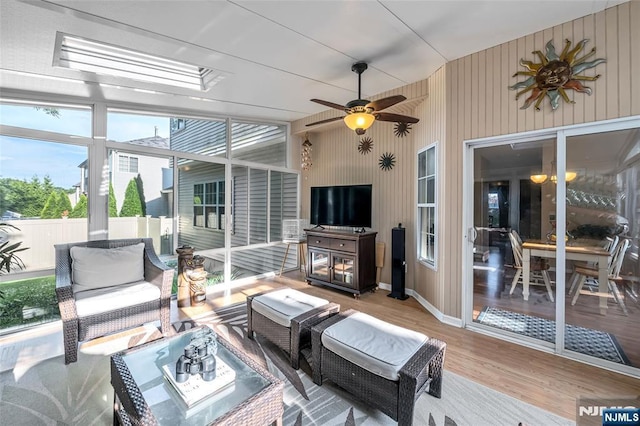 sunroom / solarium with ceiling fan