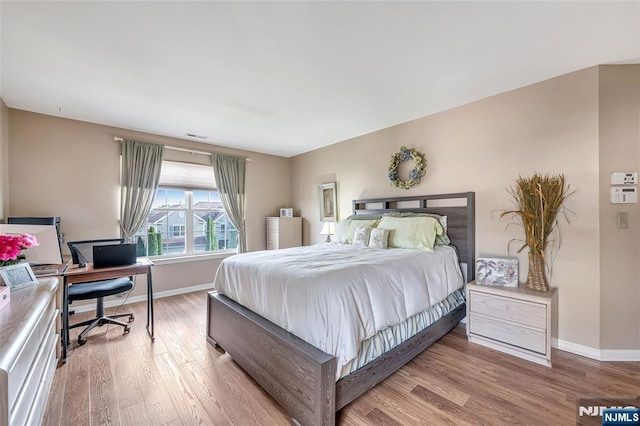 bedroom with light wood-type flooring