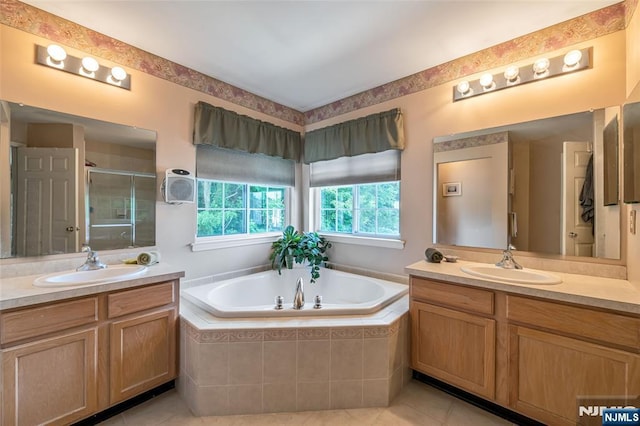 bathroom with vanity, tile patterned floors, and shower with separate bathtub