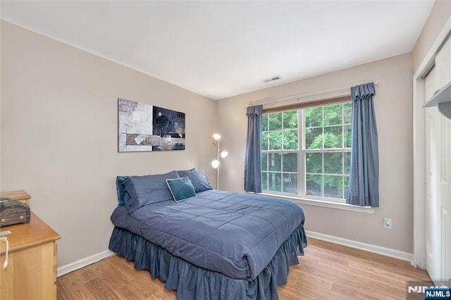 bedroom featuring light wood-type flooring