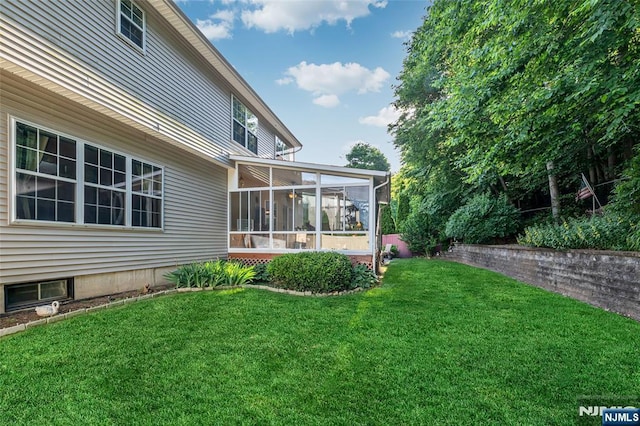 view of yard with a sunroom