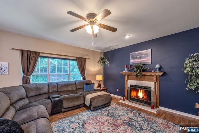 living room with hardwood / wood-style flooring and ceiling fan