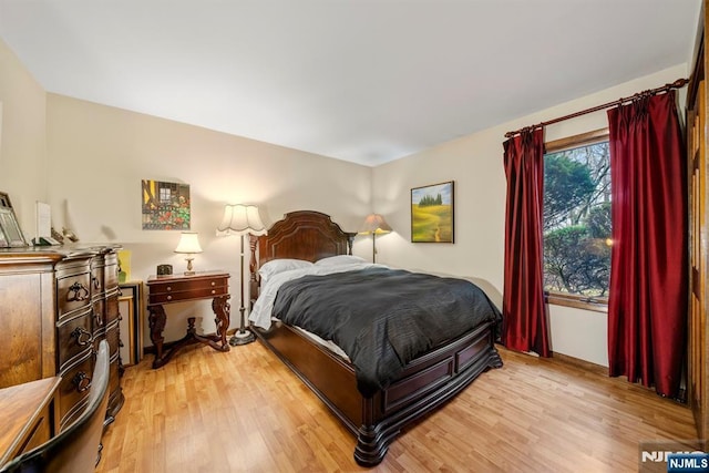 bedroom with hardwood / wood-style flooring