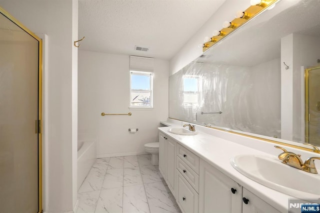 full bathroom with vanity, toilet, separate shower and tub, and a textured ceiling