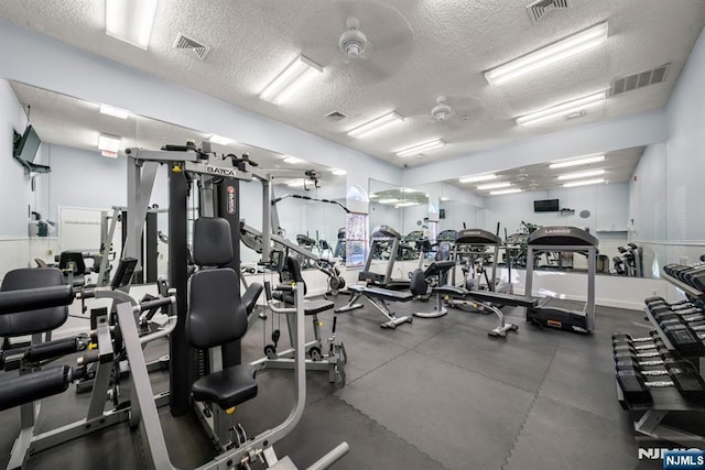 workout area with a textured ceiling