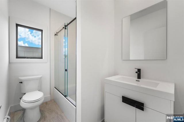 full bathroom with toilet, vanity, bath / shower combo with glass door, and a baseboard heating unit