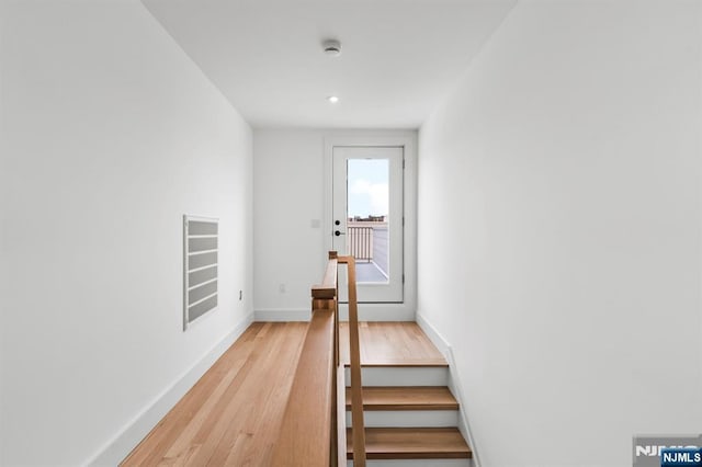 stairway featuring hardwood / wood-style floors